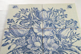 An antique vase with flowers.  Bathroom tile mosaic/Kitchen backsplash.