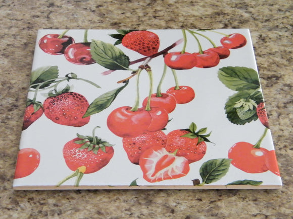 Ceramic kitchen trivet. Cherries and strawberries